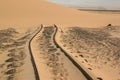 Tyre tracks in desert sand Royalty Free Stock Photo