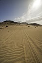 Tyre tracks in the sand Royalty Free Stock Photo