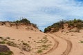 Tyre Tracks Across A Sand Dune Royalty Free Stock Photo