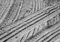 Tyre tracks on sandy road with blur effect in black and white. Royalty Free Stock Photo