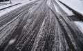 Tyre tracks in the snow on a minor road
