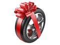 Tyre with a wrapped red ribbon.