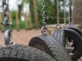 Tyres hanging on chains lined up on an obstacle course Royalty Free Stock Photo