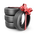 Tyres with a red ribbon. Present. 3D Icon Royalty Free Stock Photo