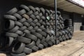 Tyres stacked herringbone outside for recycling Royalty Free Stock Photo