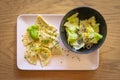 tyrolean dumplings filled with spinach served with chives, basil leaves and green salad Royalty Free Stock Photo