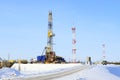 Industrial winter landscape with a drilling rig in the North of Siberia