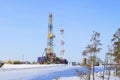 Industrial winter landscape with a drilling rig in Western Siberia