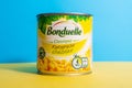 Tyumen, Russia-april 17, 2021: Bonduelle corn in tin cans on a multicolored yellow background.