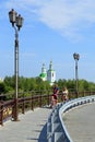 Russian family on a walk on the bridge in Tyumen