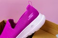 Tyumen, Russia-August 27, 2021: Slip-on shoes for women Skechers Go Walk Joy purple. Skechers USA, Inc. is an American