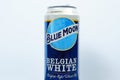 Tyumen, Russia-December 23, 2020: Blue Moon beer can. Belgian White Ale from Tenth and Blake Beer Company, division of Chicago-