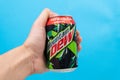 Tyumen, Russia-December 10, 2020: Mountain Dew PepsiCo can logo with water drops close up. selective focus Royalty Free Stock Photo