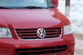 Tyumen, Russia-January 25, 2024: Red Volkswagen car stands out with a dusting of snow on its hood, signaling a chilly Royalty Free Stock Photo