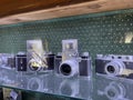 Tyumen, Russia-July 28, 2022: Old retro cameras in the museum, an exhibition of old photo accessories. The history of