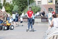 Tyumen, Russia, on July 15, 2018: the teenage boy rides a giroskuter in the summer on the square. Royalty Free Stock Photo