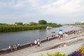 Tyumen, Russia, on July 29, 2018: Walking motor ships float along brisk Tura River Embankment in Tyumen.