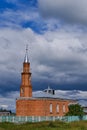 Local mosque from red bricks in the Siberian village Novoaptula, Russia