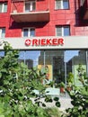 Tyumen, Russia-June 14, 2023: Rieker logo and sign text of shop German chain brand of shoes manufacturer. Vertical photo