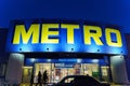 Tyumen, Russia-March 18, 2024: Metro sign stands prominently against the backdrop of a bustling city skyline.