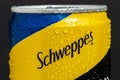 Tyumen, Russia-May 25, 2021: Can of the Schweppes logo close up. Water drops.