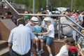 Tyumen, Russia, on May 9, 2019: The field kitchen on the square. People taste soldier`s porridge during the holiday Victory Day