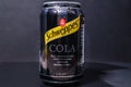 Tyumen, Russia-November 02, 2020: Can of the Schweppes cola logo close up. Water drops