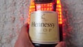 Tyumen, Russia-November 27, 2021: Hennessy vsop logo in hand, the brand of the famous cognac from France. Selective