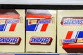 Tyumen, Russia-November 04, 2023: Chocolate bar Snickers logo on the shelves of the hypermarket. Buying sweets.