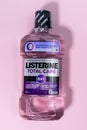 Tyumen, Russia-October 15, 2021: Listerine Total Care 6 in 1 plastic bottles of oral protection liquid. Vertical photo