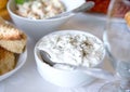 Tzatziki sauce. Greek yogurt cucumber dip in white bowl over table. Royalty Free Stock Photo