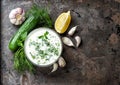 Tzatziki sauce ingredients cucumber, garlic, dill Food background