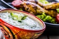 Tzatziki sauce. Tzatziki dressing. Tzatziki dressing with grilled chicken legs and fresh vegetable,lettuce leaf and cherry Royalty Free Stock Photo