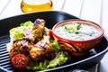 Tzatziki sauce. Tzatziki dressing. Tzatziki dressing with grilled chicken legs and fresh vegetable,lettuce leaf and cherry Royalty Free Stock Photo