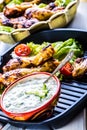 Tzatziki sauce. Tzatziki dressing. Tzatziki dressing with grilled chicken legs and fresh vegetable,lettuce leaf and cherry Royalty Free Stock Photo