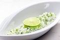 tzaziki salad with lime in white bowl Royalty Free Stock Photo