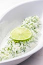 tzaziki salad with lime in white bowl Royalty Free Stock Photo