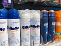 View on isolated Gillette shaving foam cans in shelf of german supermarket