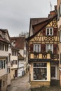 Medieval architecture: German half timbered building with pitched roof on a medieval cobbled alley or alleyway