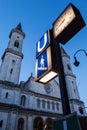 U-Bahn sign and St. Ludwig's Church (Ludwigskirche) in the eveni