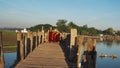 U-BEIN BRIDGE, AMARAPURA, MYANMAR SEPTEMBER 21: Buddhist monks on their daily walk across the bridge in the early morning hours