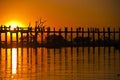 U Bein bridge and people at sunset Royalty Free Stock Photo