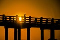 U Bein bridge and people at sunset Royalty Free Stock Photo