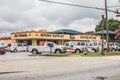 U Haul rental retail store Stone Mountain Highway street view parked trucks and building cloudy sky