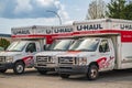 U-Haul vans parked on a street in Vancouver Canada. U-Haul is an American company offering DIY moving solutions