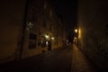 U Luzickeho Seminare street at night, dark and empty, in the city center of Prague, with a cobblestone pavement Royalty Free Stock Photo