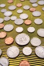 U.S coins on yellow surface Royalty Free Stock Photo