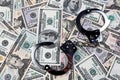 U.S. dollars bank notes and handcuffs. Royalty Free Stock Photo