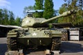 A U.S. M41 Walker Bulldog tank with a German V1 rocket model in the background