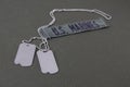 U.S. MARINES Branch Tape with dog tags on olive drab uniform